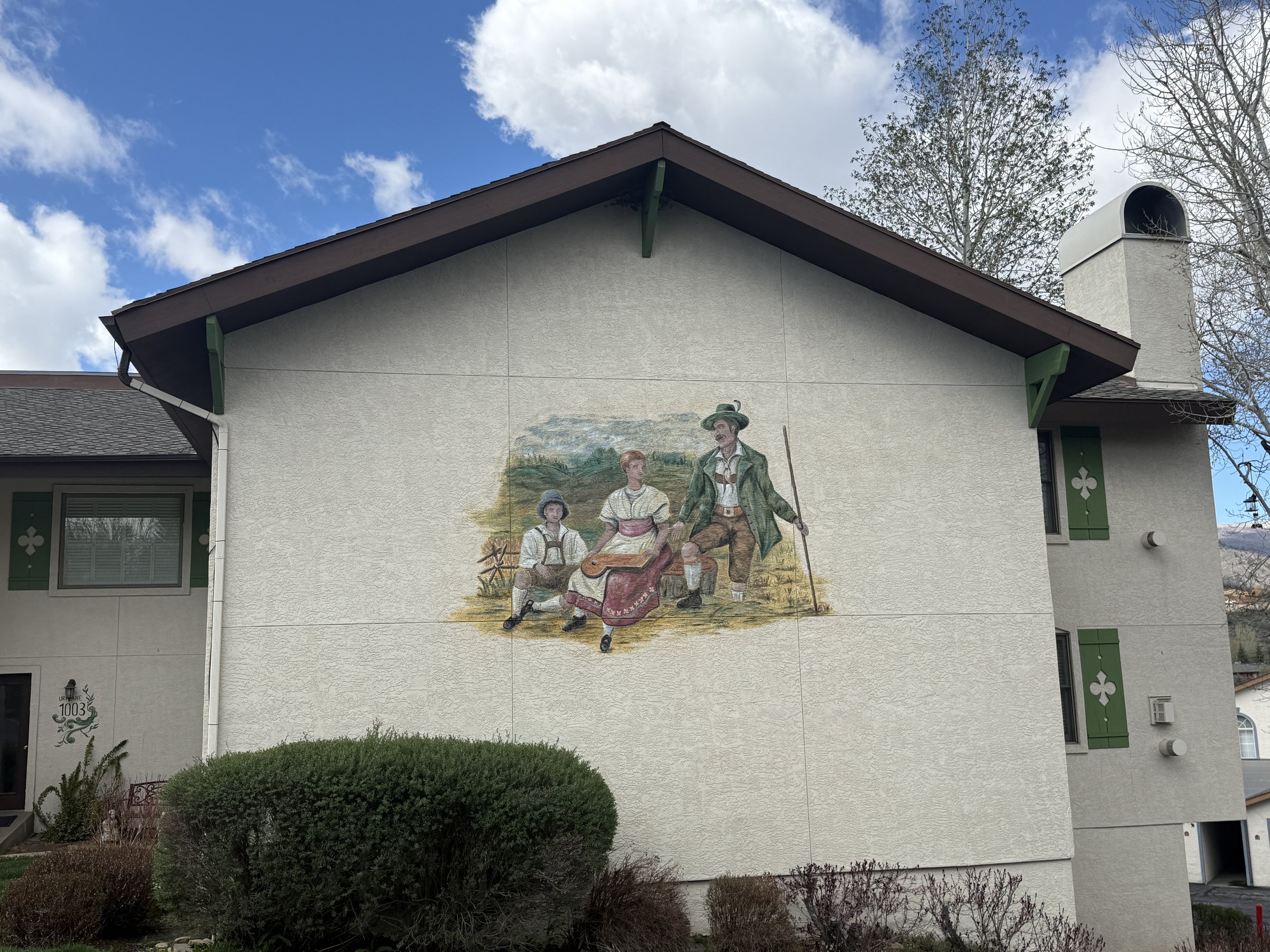 Swiss Oaks community art installation on a neighborhood building reflecting Midway Alpine heritage