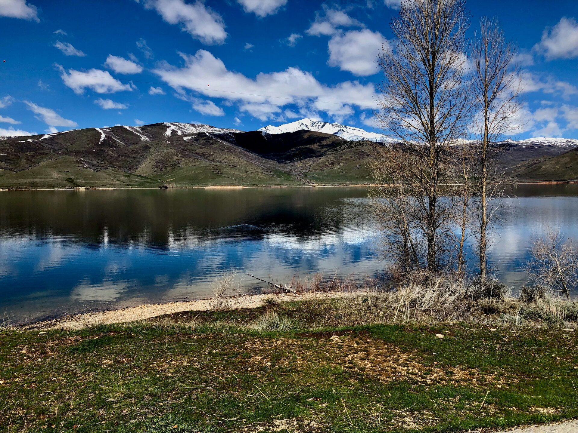 Deer Creek Reservoir and snow-capped Wasatch mountains in Heber Valley Utah