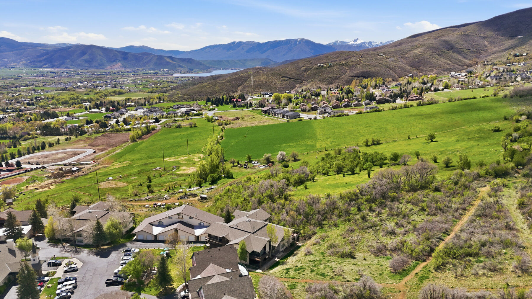 Aerial of Swiss Oaks community and Heber Valley with mountains in Midway Utah