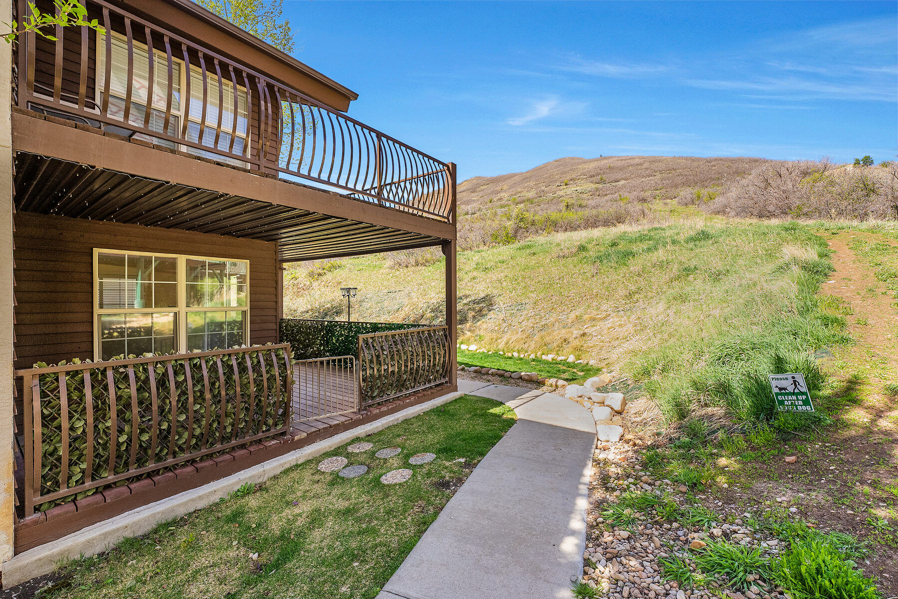 Swiss Oaks condominium building exterior with decks and hillside in Midway Utah