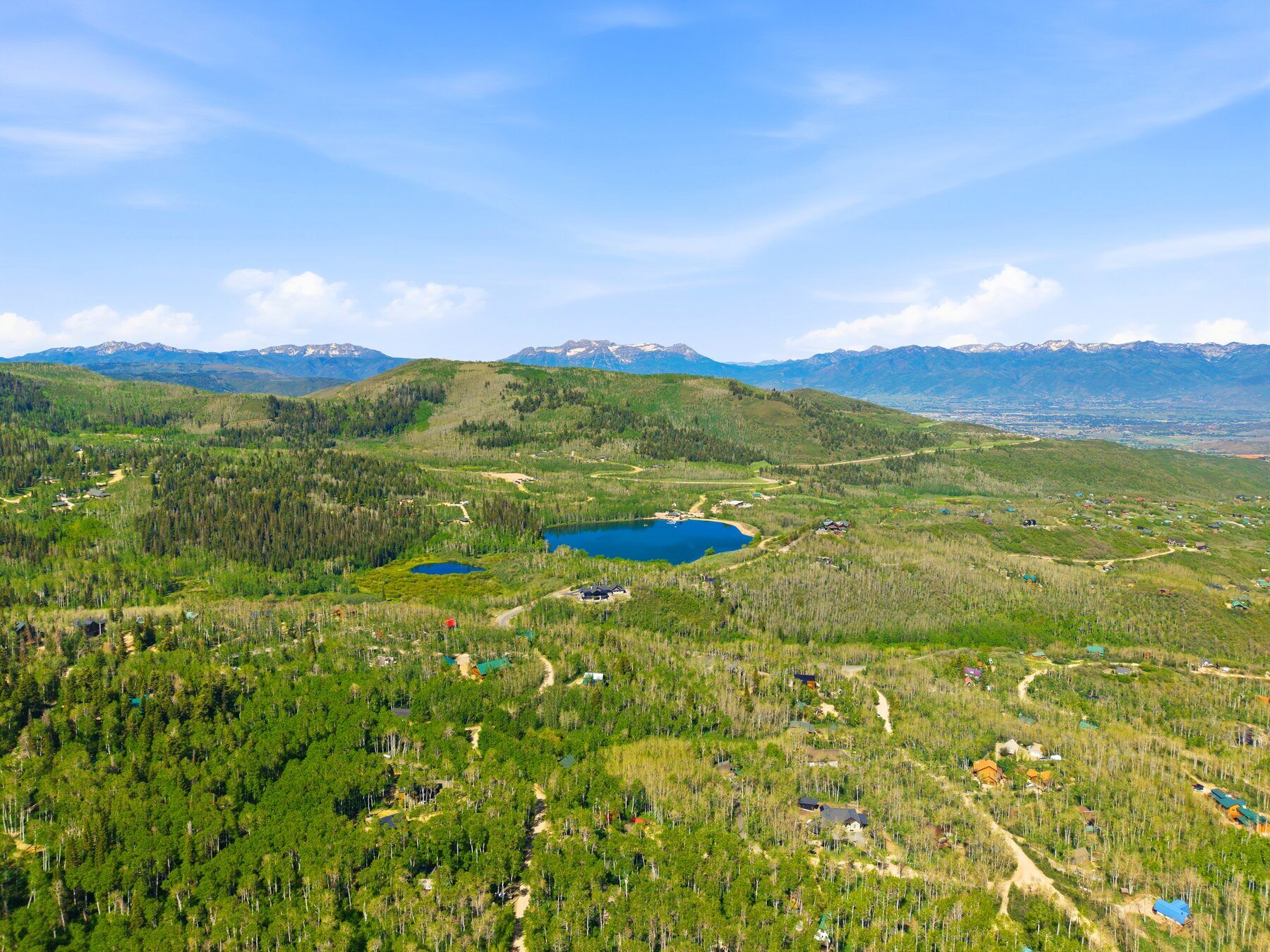 Drone view of the Timber Lakes forest with mountain valley and lakes in the distance