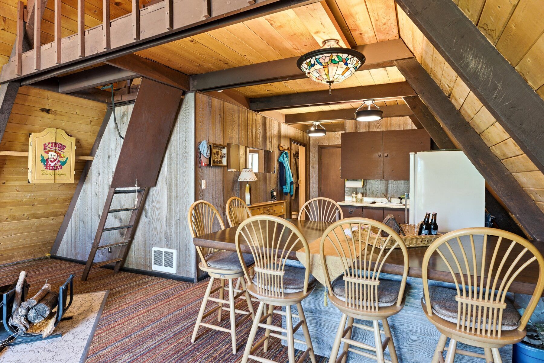 Dining area beside the window wall in a Heber City mountain cabin