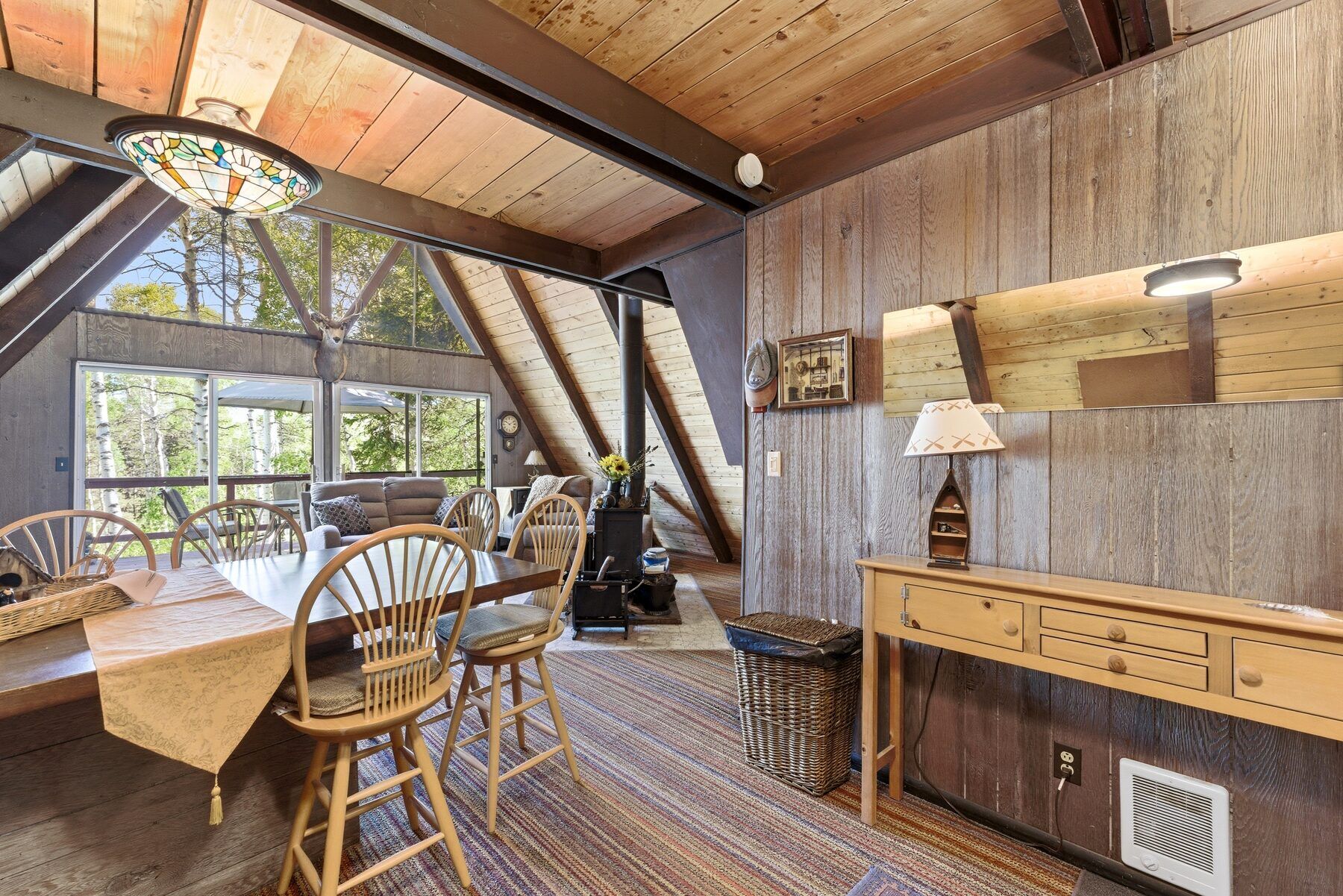Open kitchen and dining area inside Timber Lakes A-frame cabin