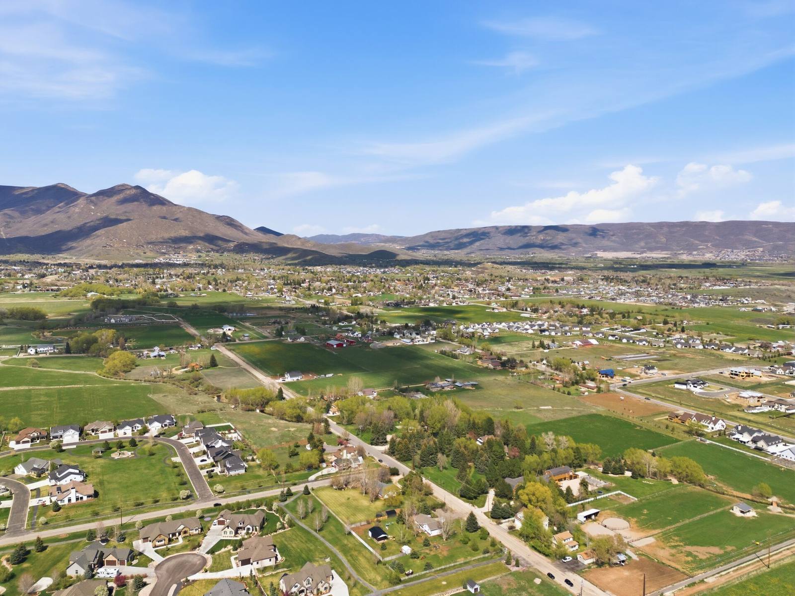Midway, Utah seen from above with Heber Valley farmland and the Wasatch Range