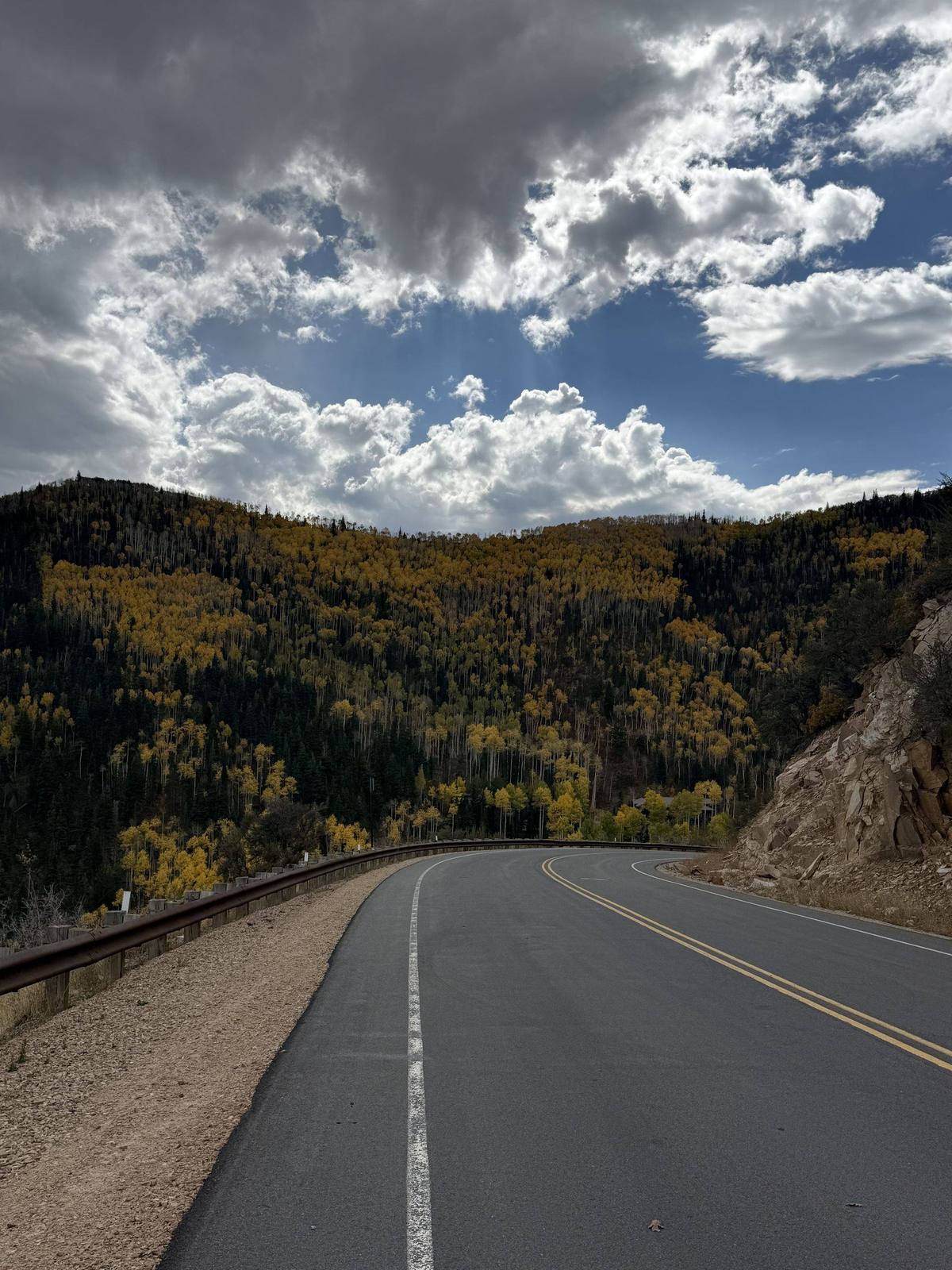 Mountain road through golden fall aspen colors near Heber Valley
