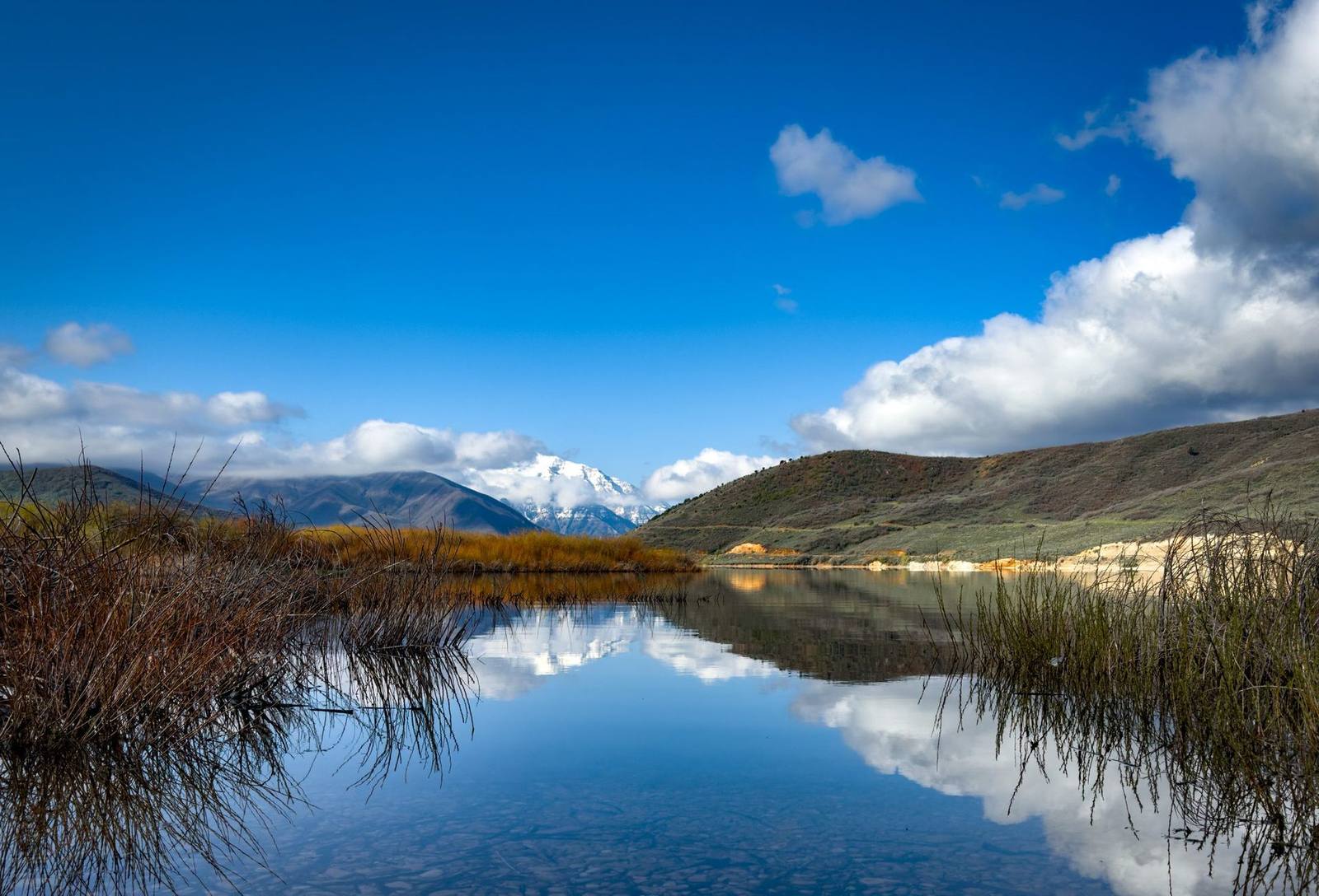 Reservoir view with Mount Timpanogos rising behind, near Heber Valley